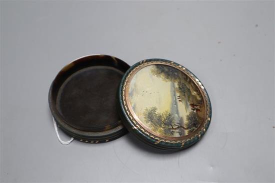 An early 19th century French bois durci snuff box, diameter 3in.